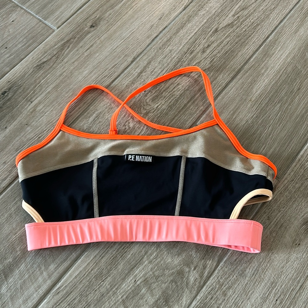 P.E Nation Colorblock Sports Bra in Black, Neon Orange, Pink & Gold